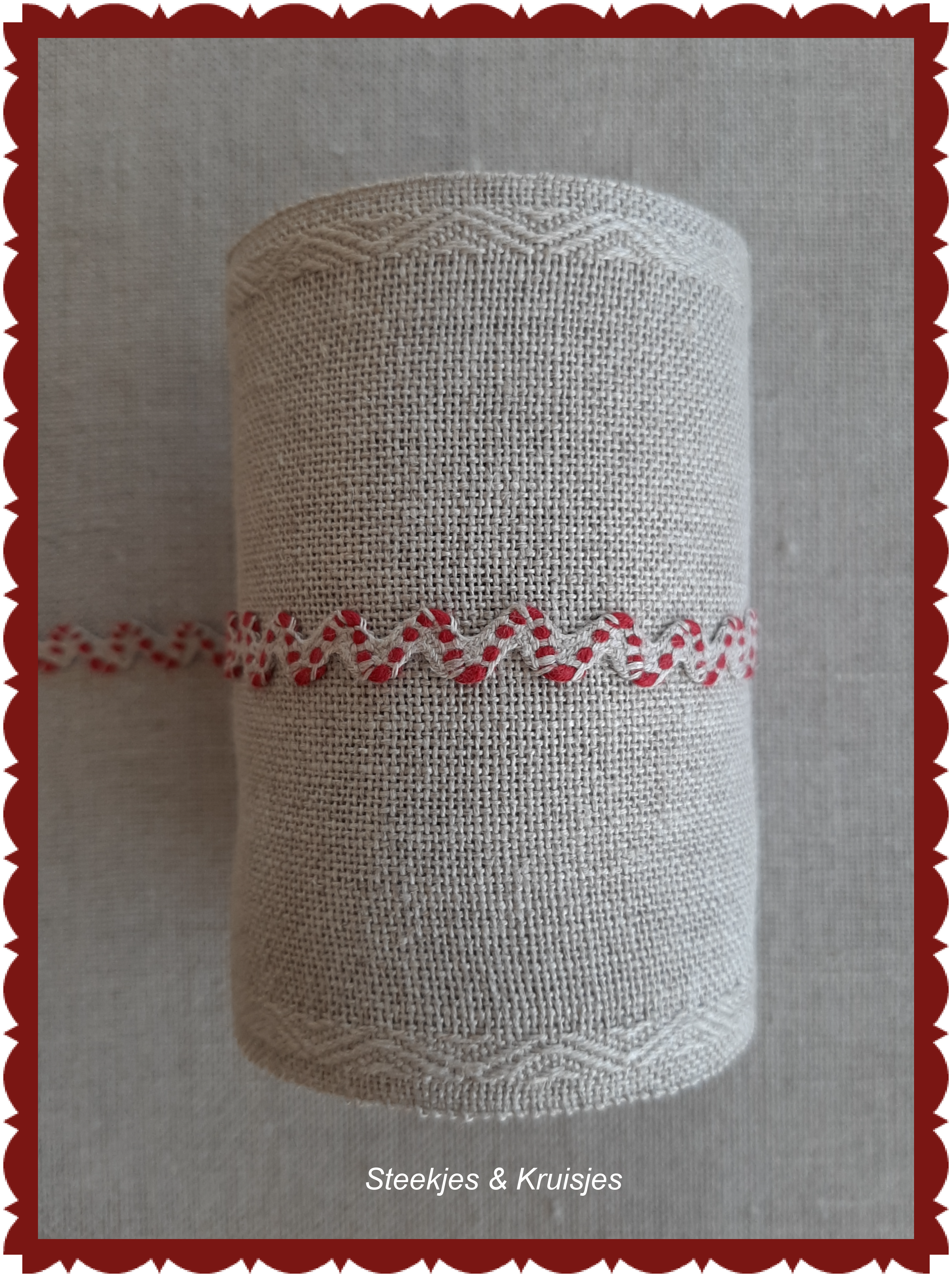 Natural serpentine ribbon with red center motif.